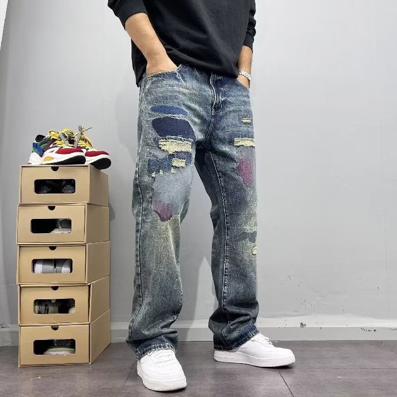 メンズ ダメージ補修デニムパンツ、バックの大きなパッチと色抜け